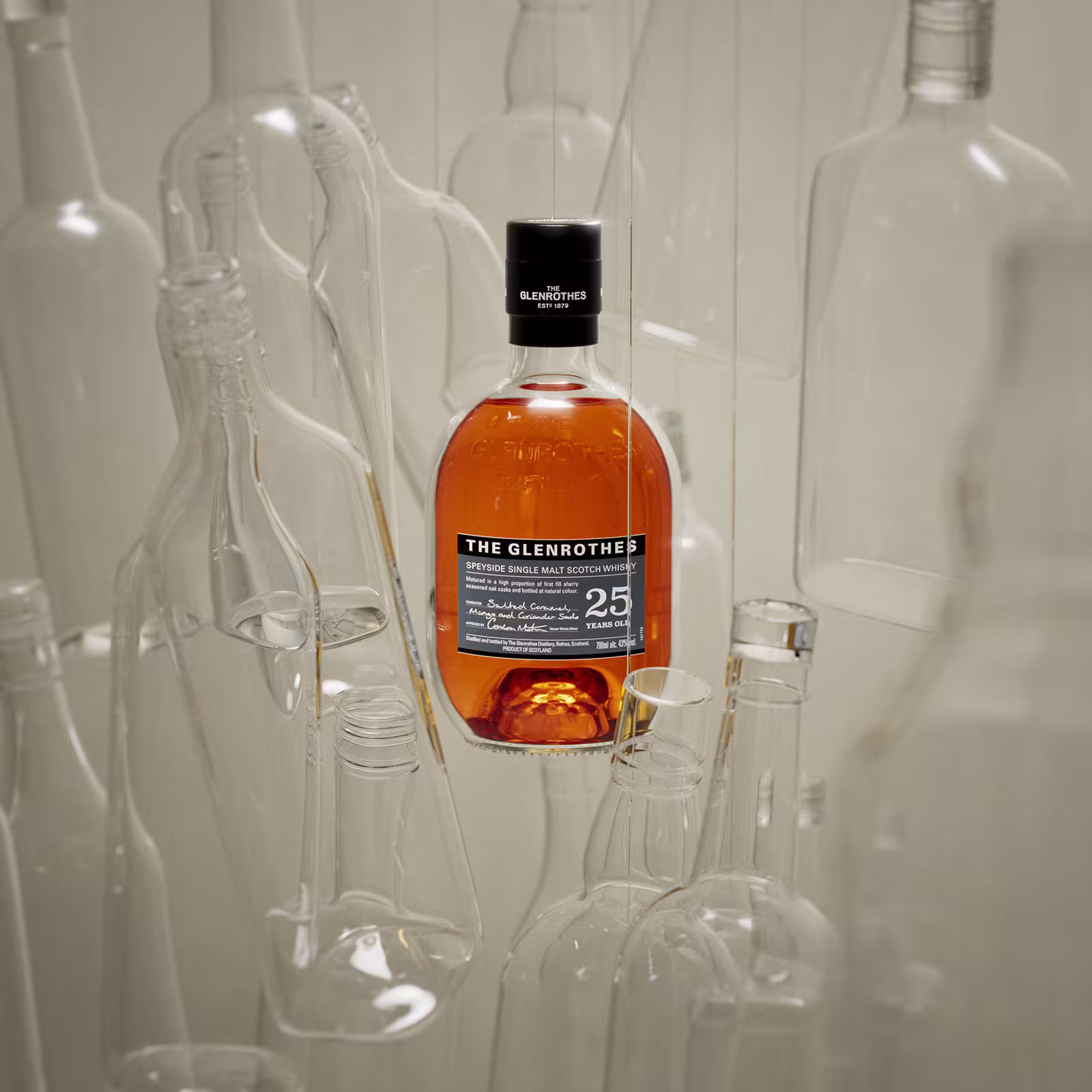 A 700ml bottle of The Glenrothes Whisky 25 Year Old in a glass world