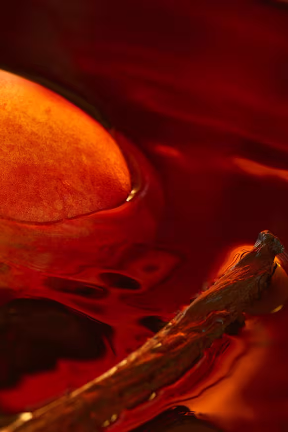 peach and vanilla pod in water