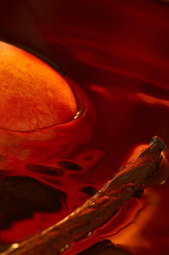 peach and vanilla pod in water